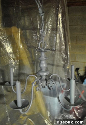 Revitalize Your Old Chandelier With Paint and a Shade Swap 21 Chandelier after receiving a coat of spray primer