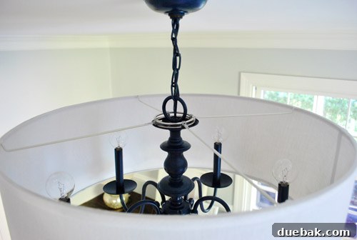 Revitalize Your Old Chandelier With Paint and a Shade Swap 25 Close-up of binder rings supporting the drum shade on the chandelier