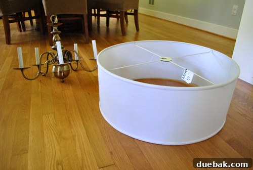 Revitalize Your Old Chandelier With Paint and a Shade Swap 6 Large white drum shade in a shopping cart
