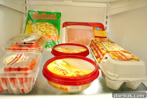Our Secret to a Fully Stocked Frugal Fridge 19 Another perspective of the restocked refrigerator, highlighting the abundant and fresh groceries.