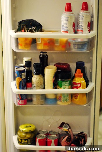 Our Secret to a Fully Stocked Frugal Fridge 20 The bottom section of the refrigerator, likely the vegetable crispers, also well-stocked and tidy.