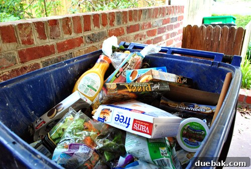 Our Secret to a Fully Stocked Frugal Fridge 8 A full trash can overflowing with spoiled food, a testament to the extensive losses from a power outage.
