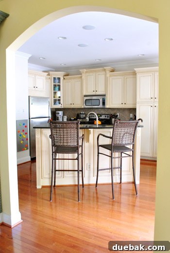 Modern kitchen with a large island, stainless steel appliances, and ample counter space.