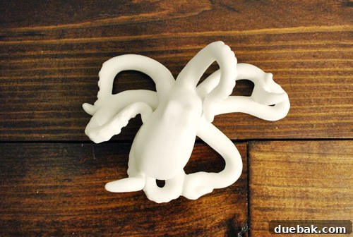 A second view of the white ceramic octopus, possibly showing more detail or a different angle.
