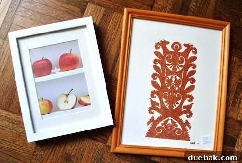 Frame with intricate paper cut design purchased from ReStore