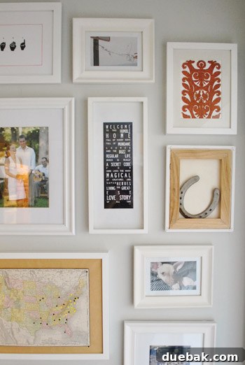 Close-up of the framed paper cut art installed in a hallway gallery
