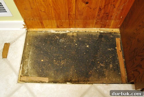 Revolutionize Your Kitchen: Smart Cabinet and Appliance Relocation 12 Exposed subfloor after pantry removal