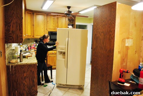 Revolutionize Your Kitchen: Smart Cabinet and Appliance Relocation 13 Moving the refrigerator to its new location
