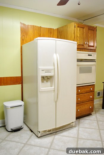 Revolutionize Your Kitchen: Smart Cabinet and Appliance Relocation 18 Kitchen side with exposed paneling and old fridge spot