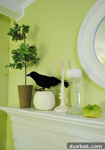 Crafting Halloween's Creepy Crawlies: Spiders and Snakes 11 Halloween mantel decor with books and a faux black crow