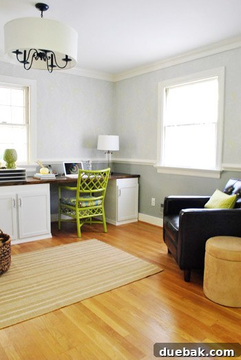 Gray Horse by Benjamin Moore: Our Chair Rail Update 4 Dark leather chair with green lumbar pillow