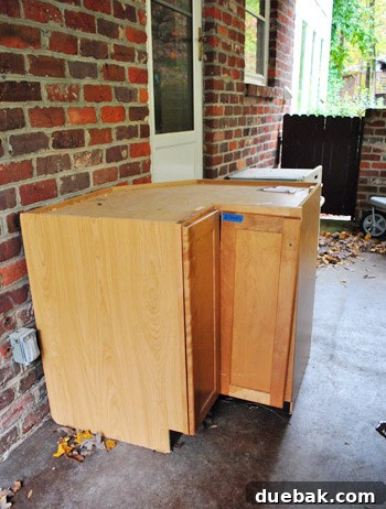Kitchen cabinets stored in a sunroom during renovation