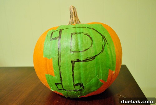 Large pumpkin with painter's tape forming the letter P