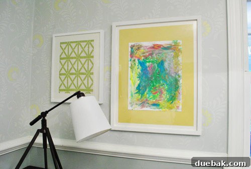 Create A Stunning Home Office Gallery Wall 4 Close-up of Sherry's art wall featuring a child's painting and framed textile
