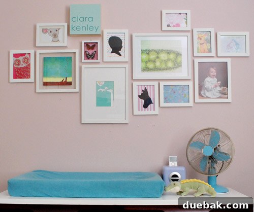 Clara's nursery gallery wall before the recent expansion, showing a smaller, but charming arrangement of framed art and photos.
