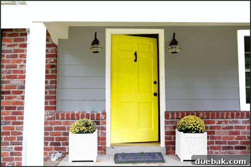 Photoshopped image of the house with proposed gray paint and white trim
