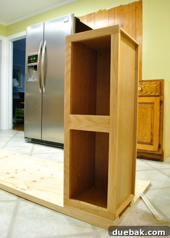 DIY Built-In Refrigerator Installation 11 Partial assembly in the kitchen, with the cabinet screwed to one plywood side panel
