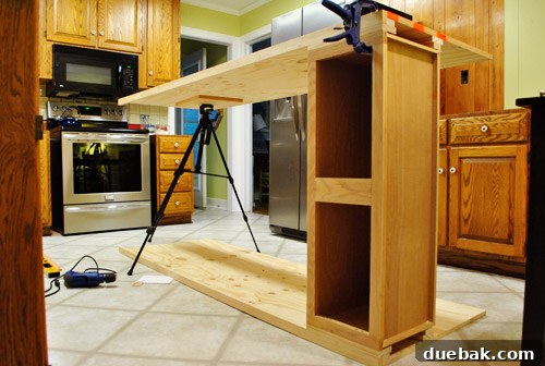 DIY Built-In Refrigerator Installation 12 Assembling the second side panel, using a camera tripod as a temporary support or jack
