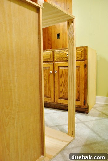 DIY Built-In Refrigerator Installation 13 Partially assembled built-in fridge enclosure with a support board added to the back for stability