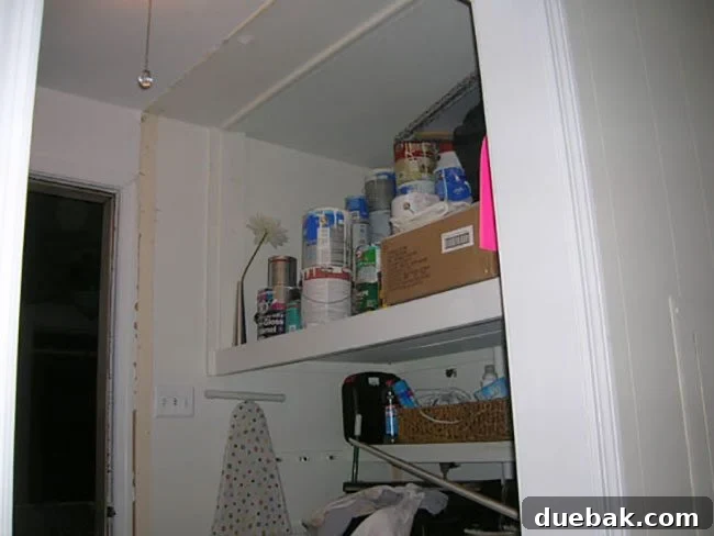 Wider view of the newly opened laundry area, demonstrating significantly improved spaciousness and light