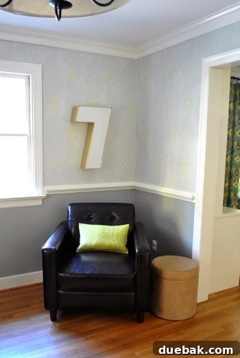 The installed industrial number '7' hanging securely on the wall, showcasing the final placement and successful DIY installation.