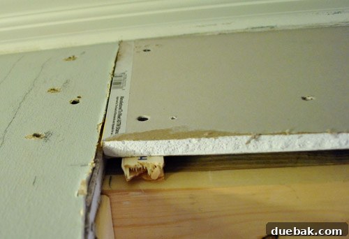 Wood shims and paint stir sticks used to adjust drywall thickness