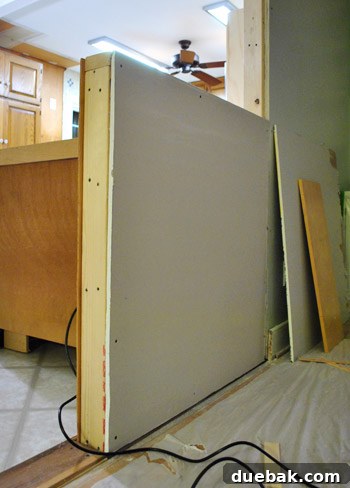 Drywall shimming on a larger half-wall section