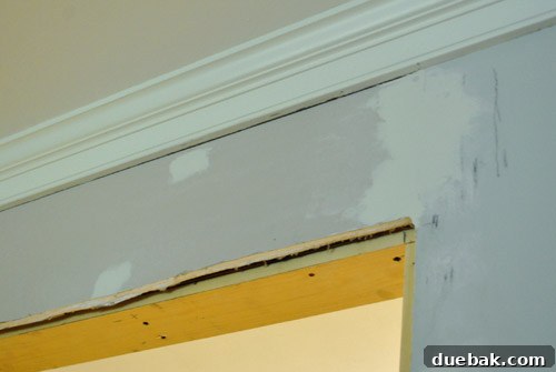 Drywall mudding in progress, showing multiple coats