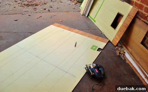Cutting drywall pieces with a jigsaw for the half-wall