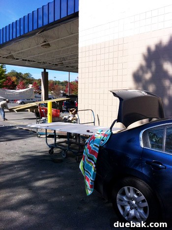 Cutting drywall in a parking lot to save on transport costs