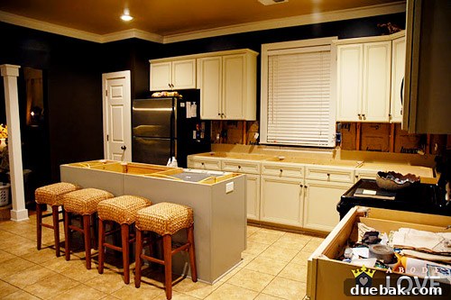 Kitchen Island Makeover with Brackets 3 During kitchen renovation showing cabinets being prepared for painting and updates
