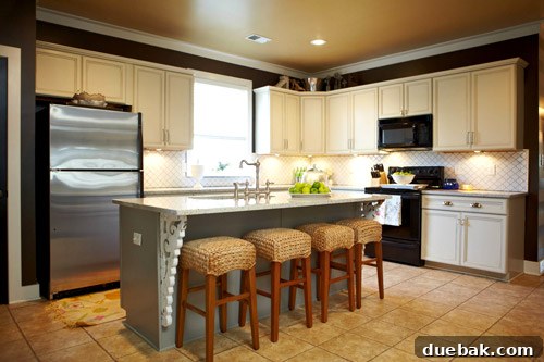 Kitchen Island Makeover with Brackets 4 Finished kitchen with white painted cabinets, dark walls, and decorative corbels on the island