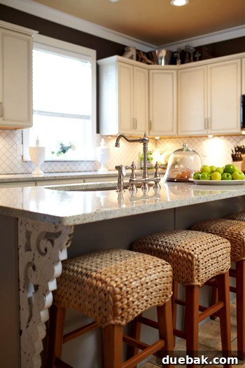Kitchen Island Makeover with Brackets 5 Close-up of the renovated kitchen showcasing the elegant white cabinets and intricate corbels