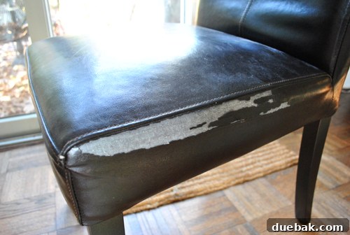 Rug Refresh Transforming Our Living Room 7 Worn out faux-leather Parsons chair with cracking upholstery