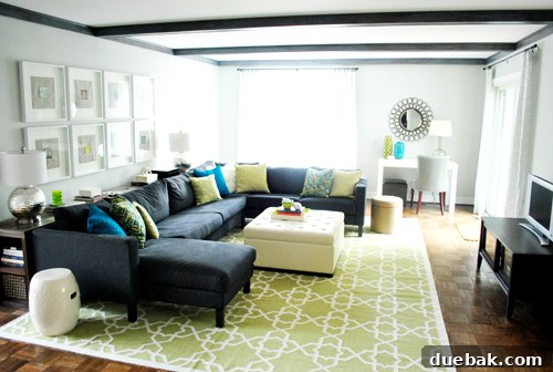 Rug Refresh Transforming Our Living Room 8 Newly installed large rug and tufted storage ottoman in a refreshed living room