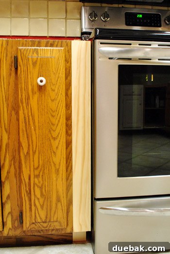 Optimize Your Kitchen: Filling Stove-Side Cabinet Gaps 13 Stove in place with completed gap fillers, looking flush