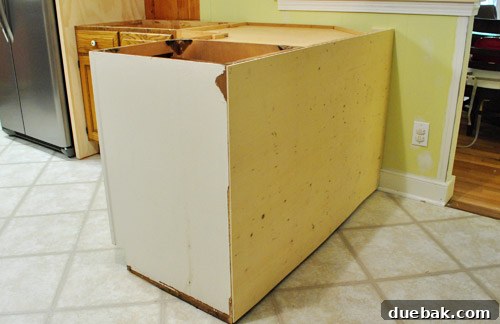 Optimize Your Kitchen: Filling Stove-Side Cabinet Gaps 18 Peninsula panel cut and nailed into place, viewed from dining area