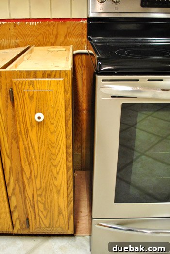 Optimize Your Kitchen: Filling Stove-Side Cabinet Gaps 3 Stove gap with first set of wood fillers installed