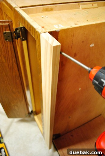 Optimize Your Kitchen: Filling Stove-Side Cabinet Gaps 4 Drilling pilot holes with a Kreg jig for stove fillers