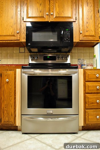Optimize Your Kitchen: Filling Stove-Side Cabinet Gaps 8 Close-up of stove gap after initial filler installation
