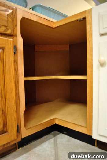 New empty corner cabinet in kitchen peninsula