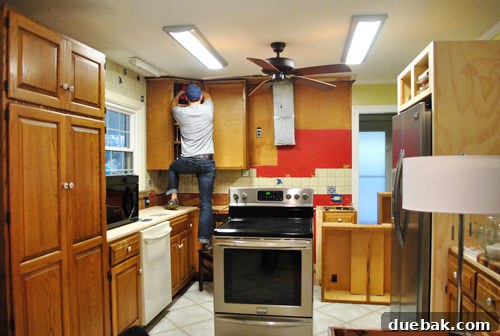 Kitchen cabinets being removed from wall