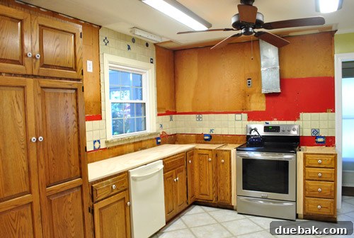 Fire engine red paint revealed behind removed cabinets