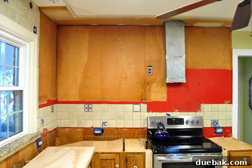 Old kitchen backsplash with unique blue tiles