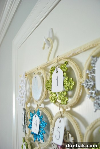 Advent calendar hung on a coat closet door with a removable 3M hook.