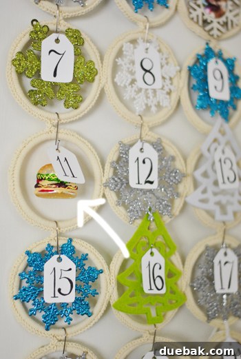 Close-up of a hamburger-shaped Christmas ornament hanging on the advent calendar.