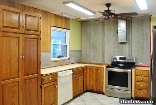 Unfinished kitchen walls and ceiling before painting