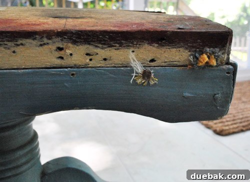 Old, damaged periwinkle blue stool before makeover