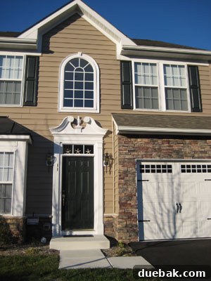 Charming beach house exterior with decorative starfish above the door in Rehoboth, Delaware