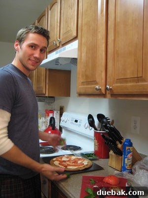Delicious homemade tomato, basil, and mozzarella pizza prepared in a beach house kitchen